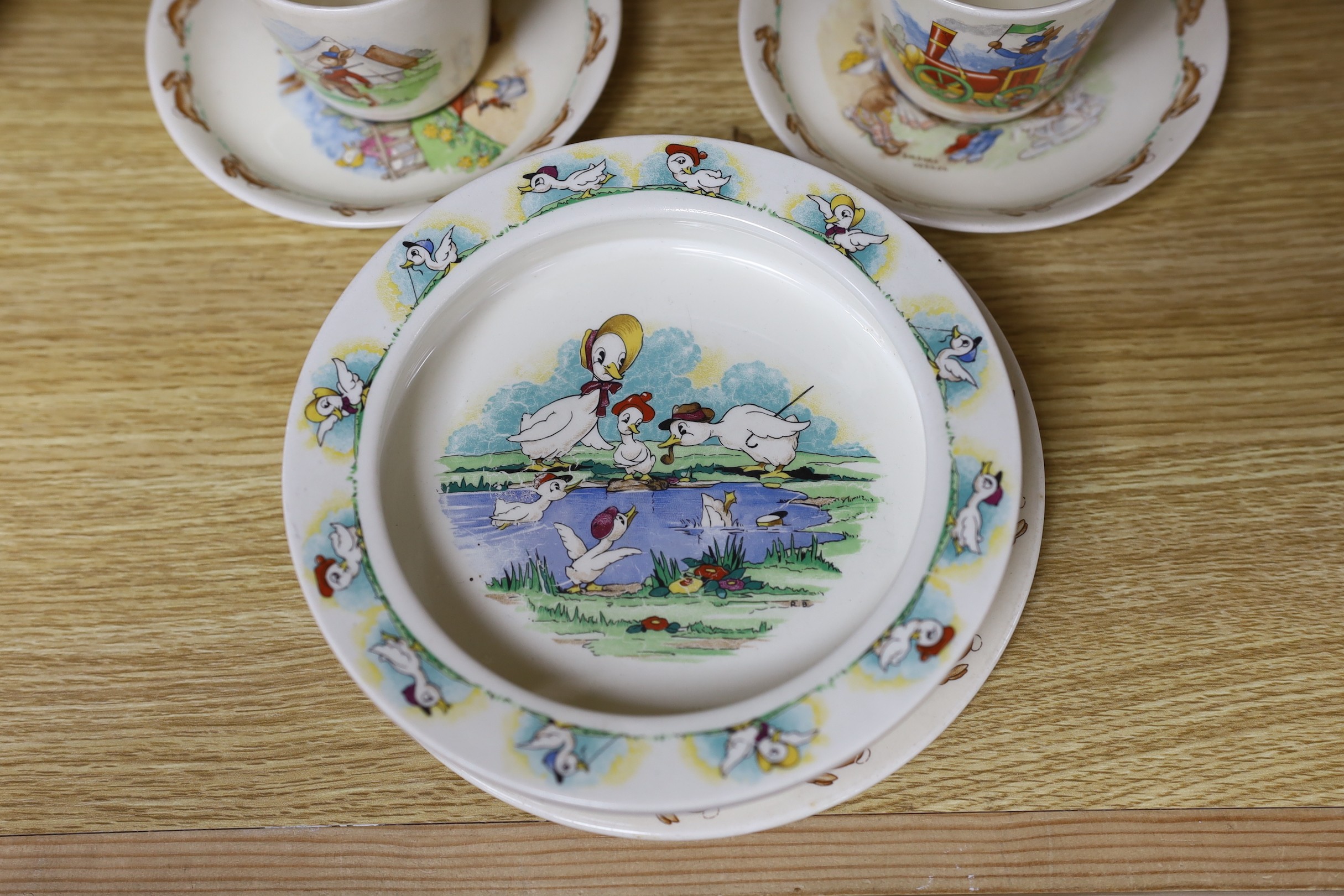 A selection of seven Royal Doulton Bunnykins tablewares, together with a Quack Quack Wade bowl